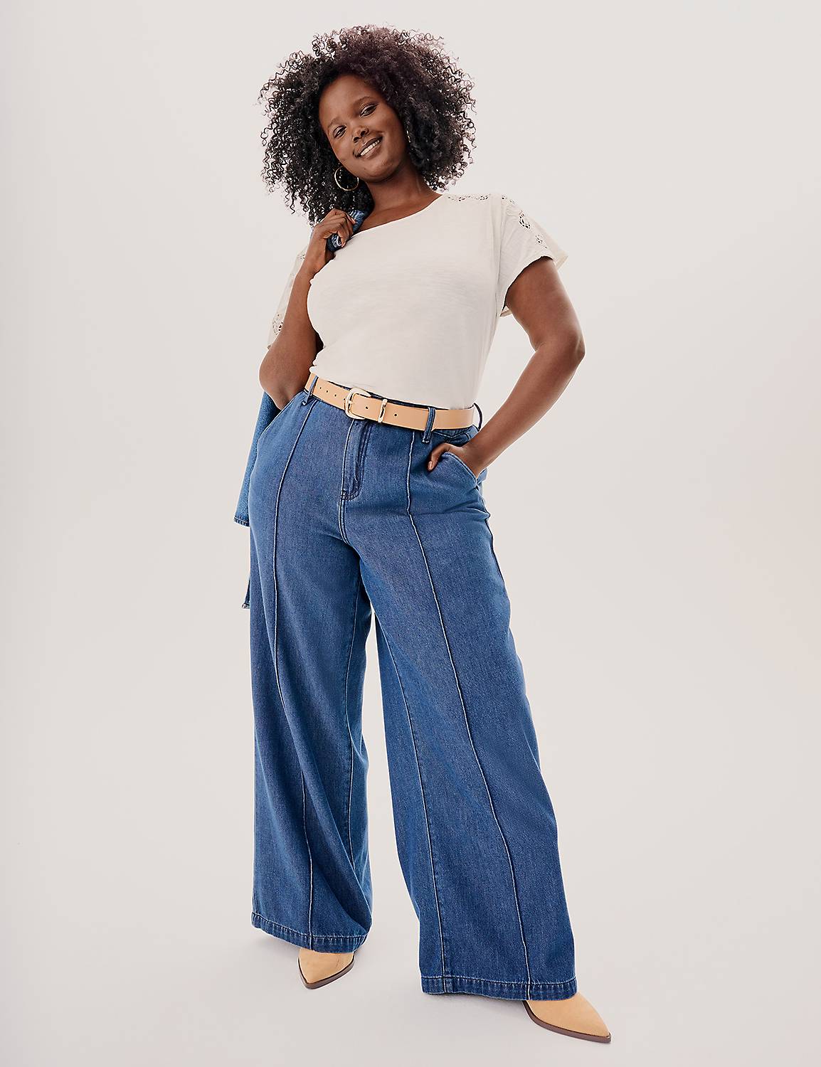 A flat-lay of Lane Bryant signature pieces: skinny denim, Cacique no-wire bra, and wide-leg trouser