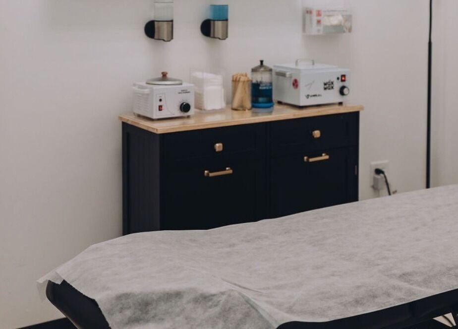 A mid-range waxing studio treatment room in the $55-$80 tier