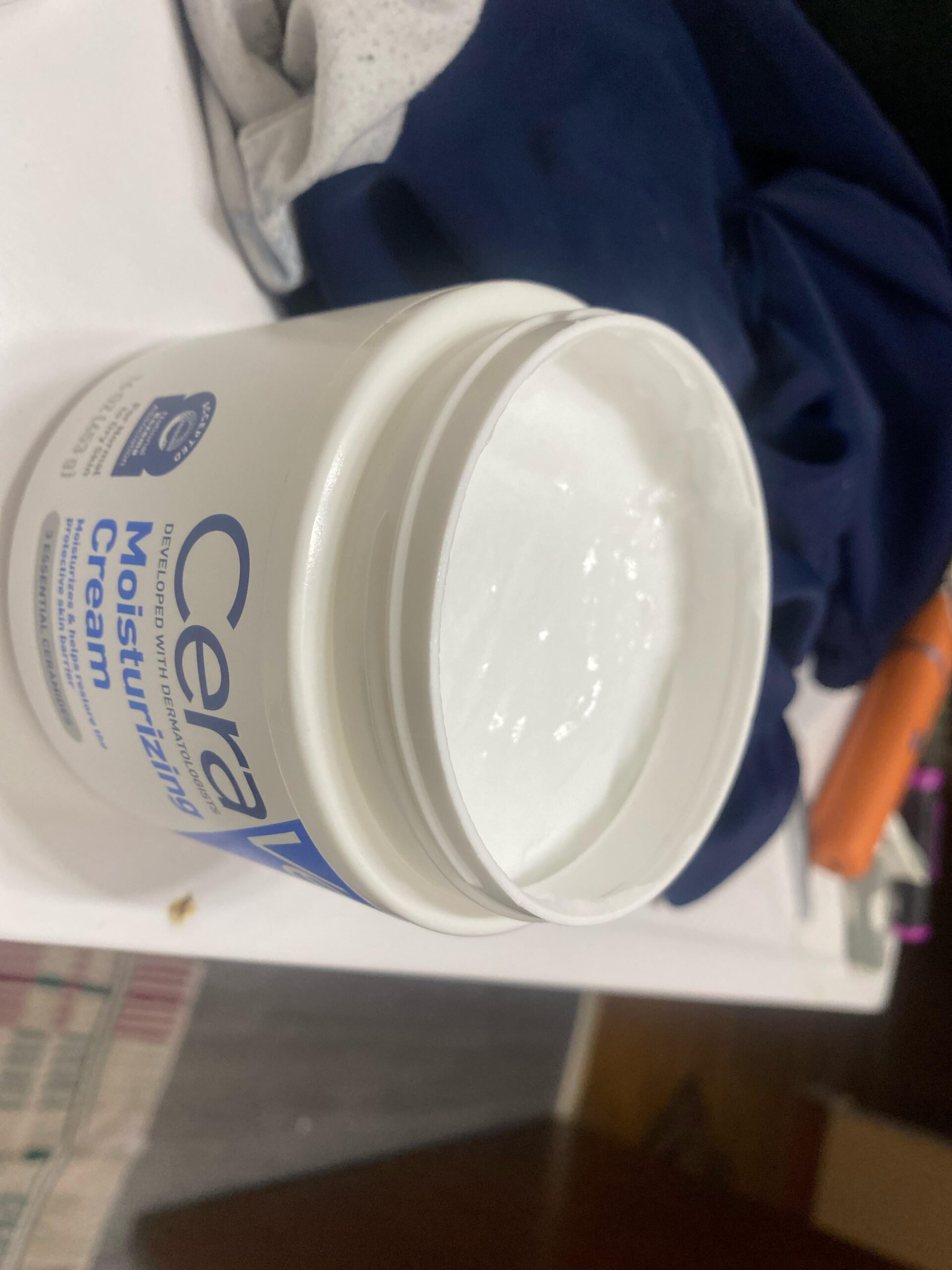 CeraVe Moisturizing Cream tub open showing the thick cream texture