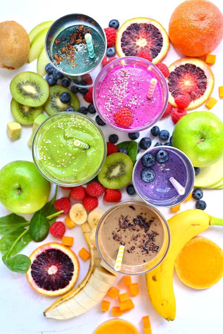 Colorful array of healthy filling smoothies with fresh ingredients