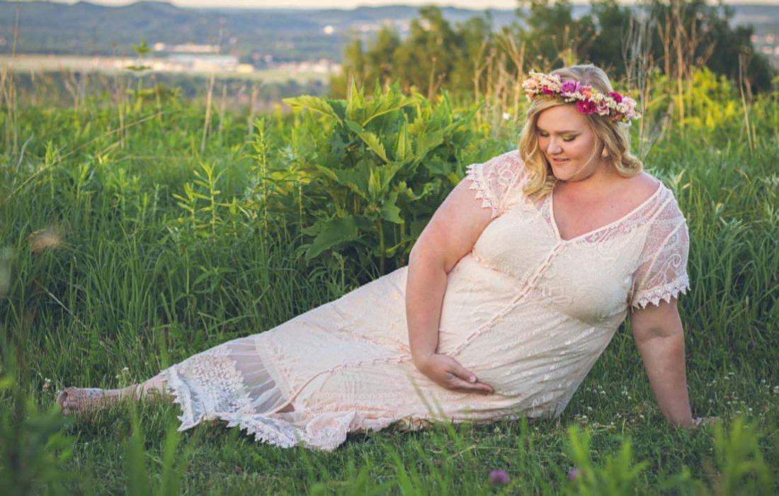 Confident plus-size pregnant woman looking stylish and radiant
