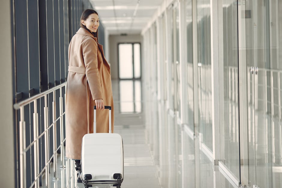 Confident plus-size woman in stylish travel outfit walking through an airport