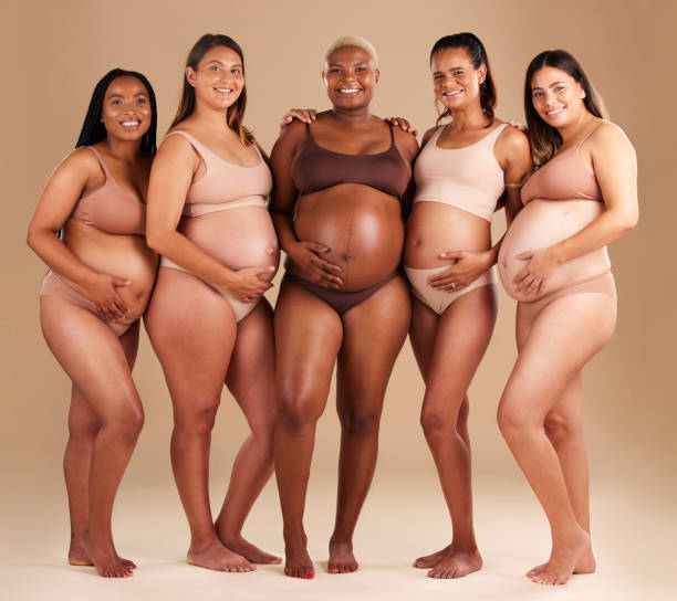 Diverse group of stylish plus-size pregnant women celebrating together