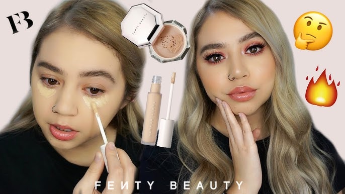 Fenty concealer in a makeup artist's kit with synthetic brush, setting powder, and hydrating eye cream