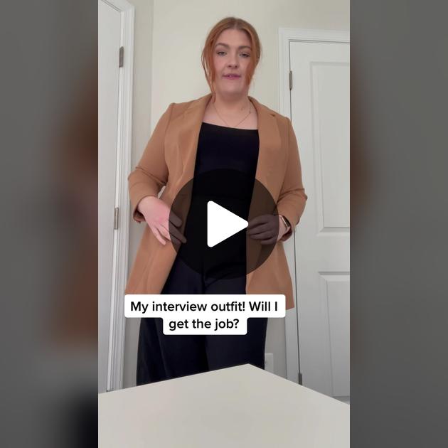Plus-size candidate in emerald silk shell for virtual job interview on Zoom