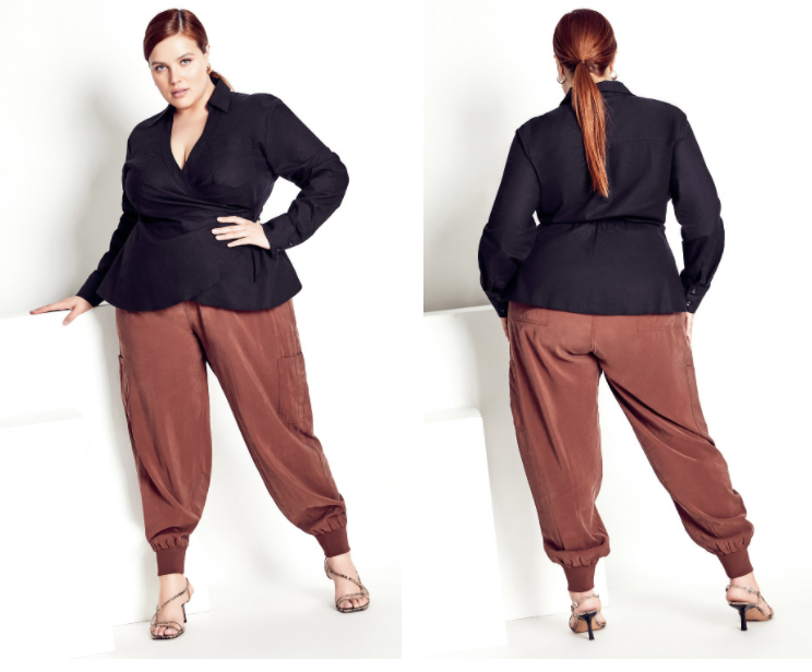Plus-size candidate in oxblood trousers and black knit for creative agency interview