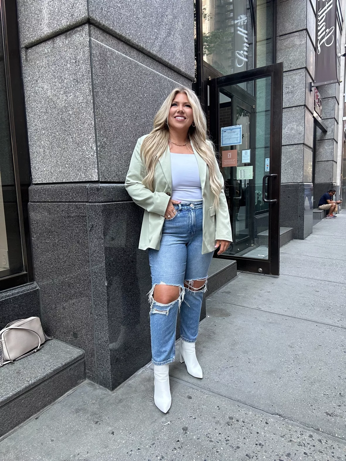 Plus-size editorial styling of Good American high-rise denim with bodysuit and blazer