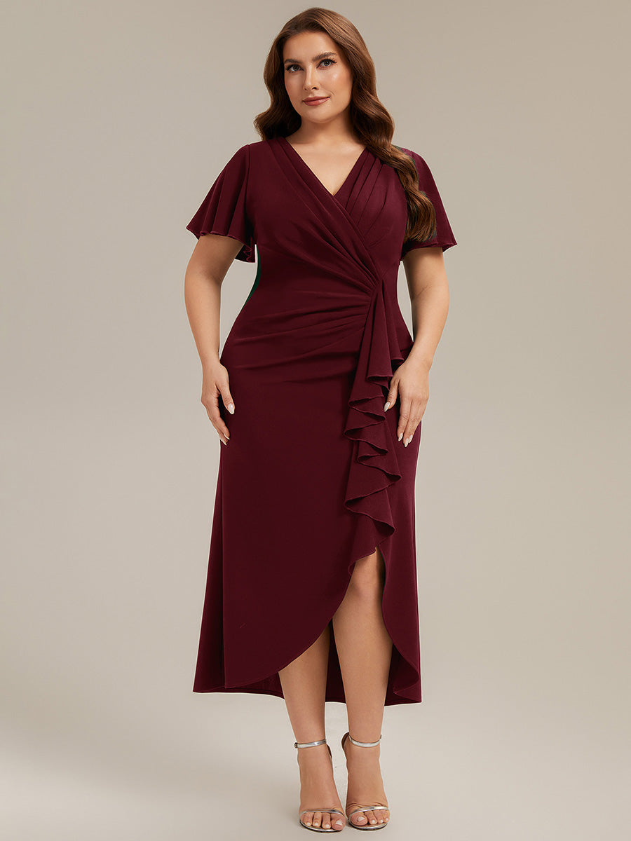 Plus-size guest in oxblood asymmetric column gown for black-tie wedding