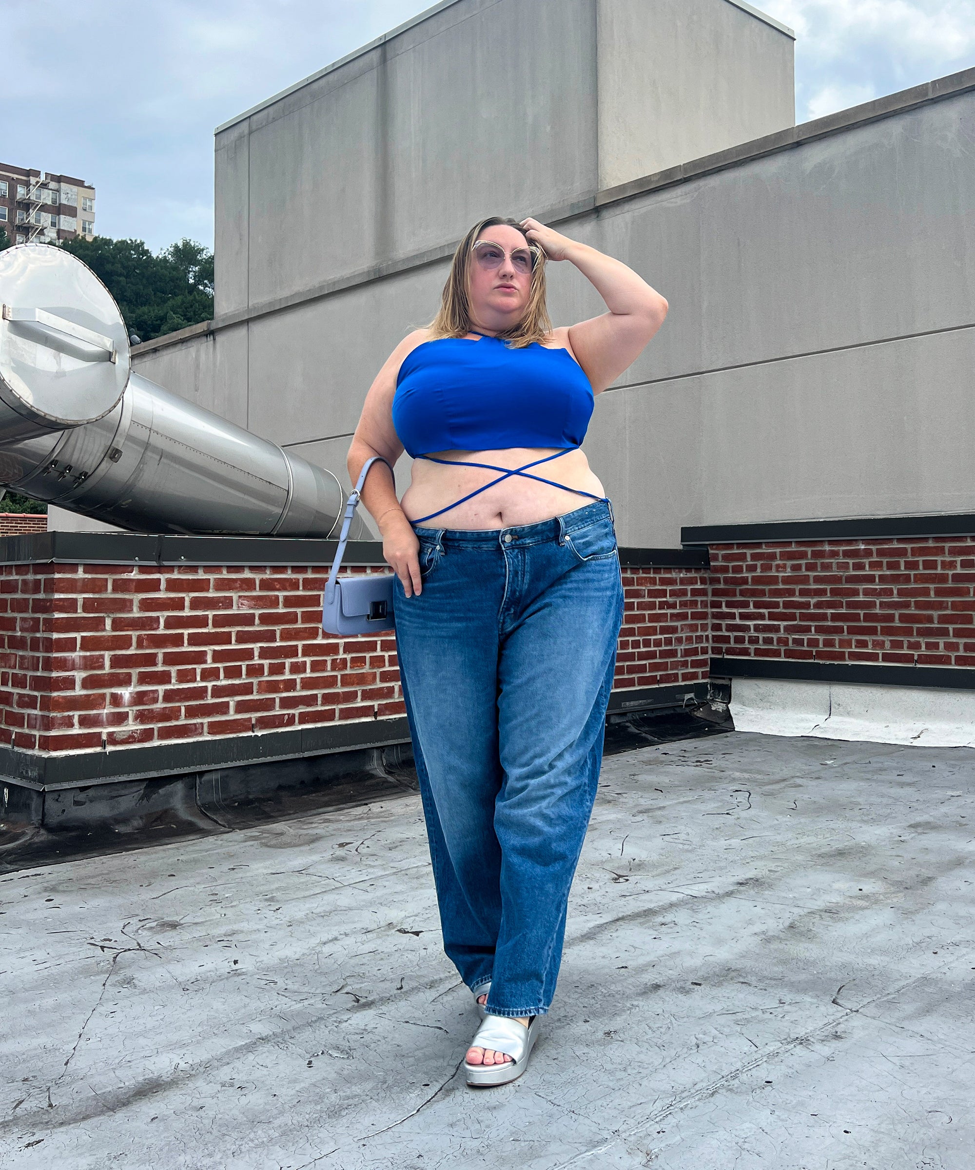 Plus-size woman wearing Madewell Curvy Perfect Vintage jeans showing the flat back-waist fit