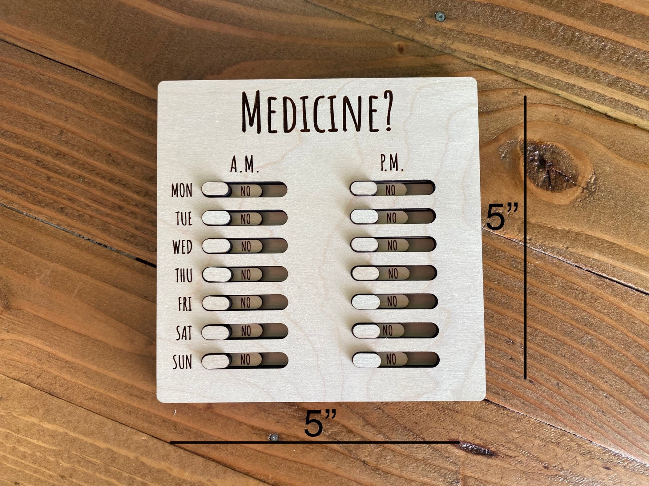 Unbranded weekly injection pen on a wooden desk with a medication tracking card