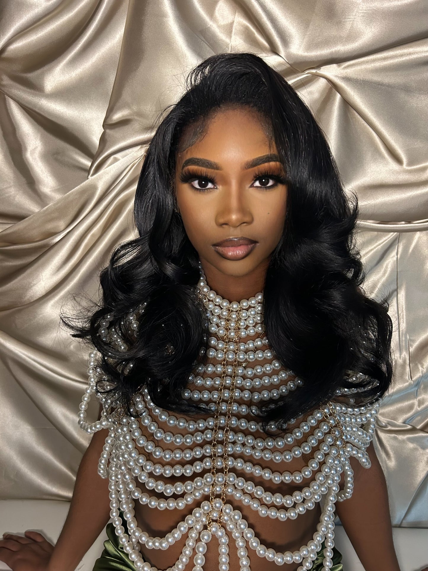 Woman wearing a mid range sew in install with lace frontal in the 500 to 900 dollar tier