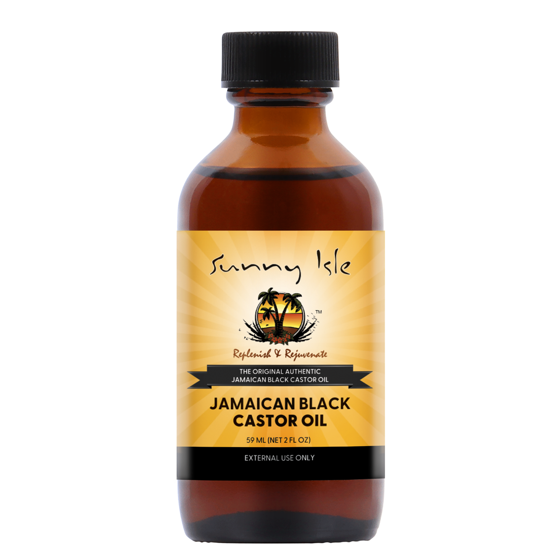 Sunny Isle Jamaican Black Castor Oil bottle with satin bonnet and processing cap on wooden shelf, beauty editorial product photography
