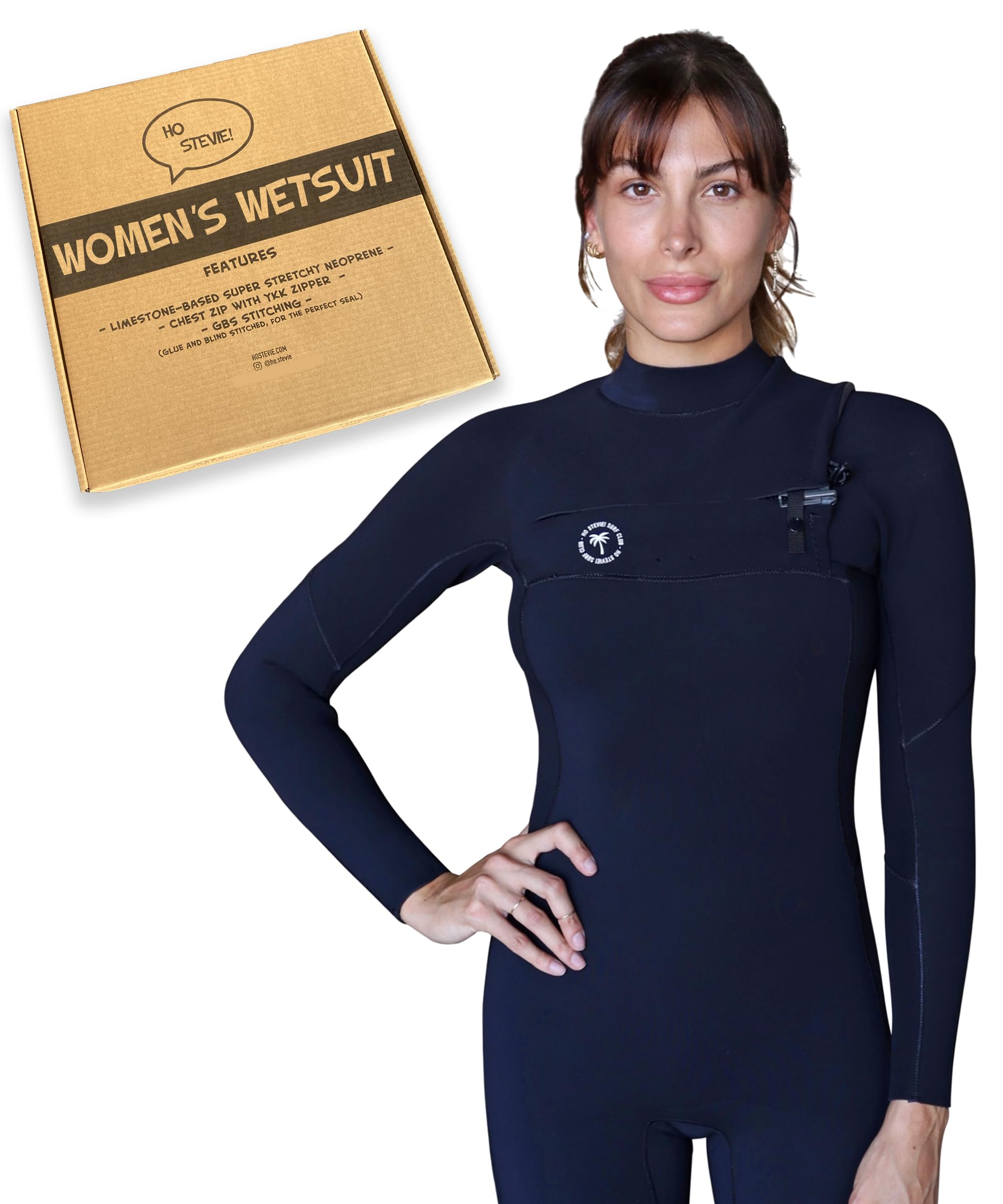 A plus-size woman surfer at a surf shop holding a longboard and a rash guard wearing a chest-zip wetsuit