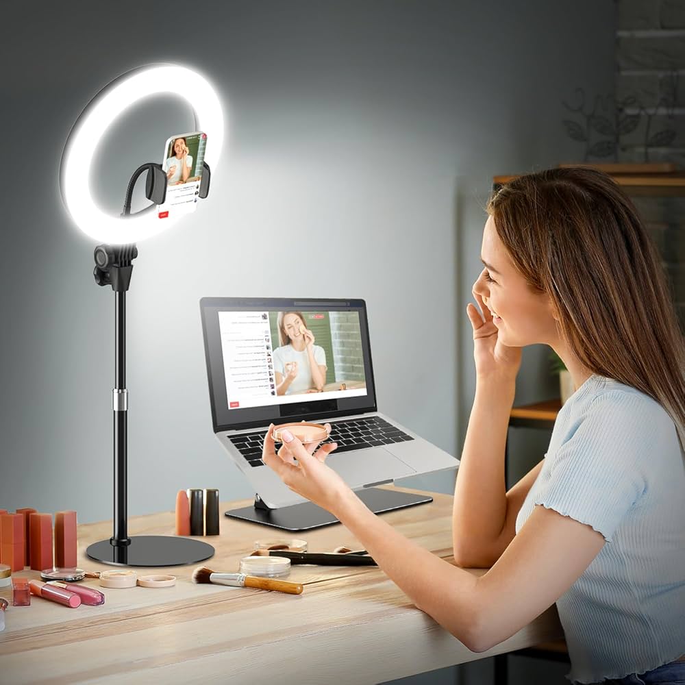 Plus-size woman holding a dress up to a tripod-mounted iPhone during a Whatnot live selling broadcast in her home with a ring light
