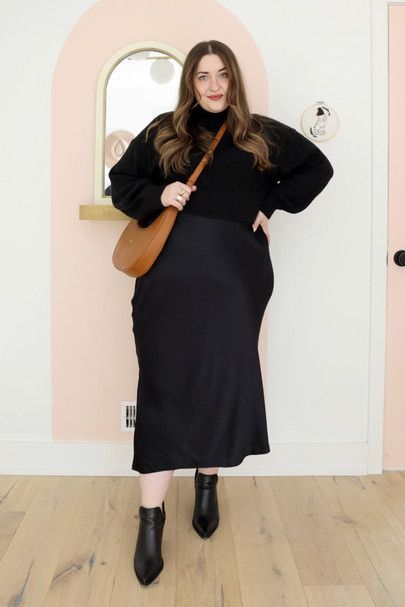Plus-size woman sorting date-night outfit candidates into five rows on a bed during a closet audit