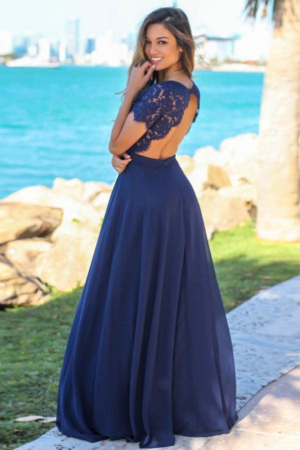 A floor-length navy bridesmaid dress with sweetheart neckline on a curved dress form