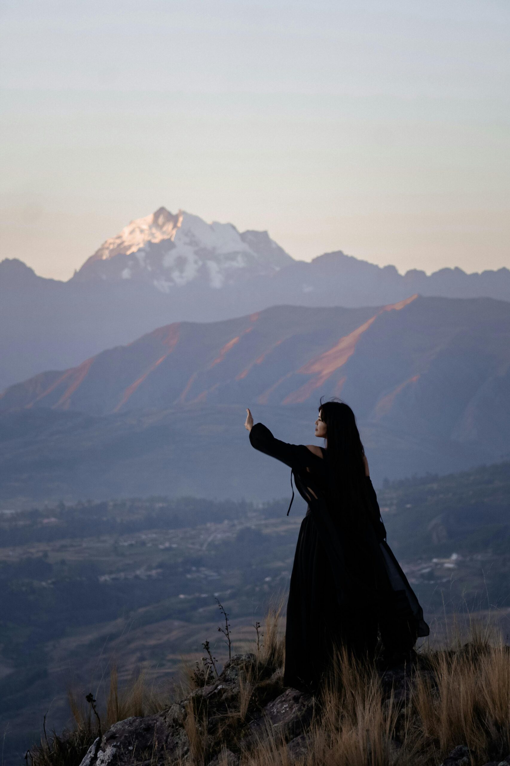 Plus-size woman stretching at a scenic overlook during a road trip rest stop