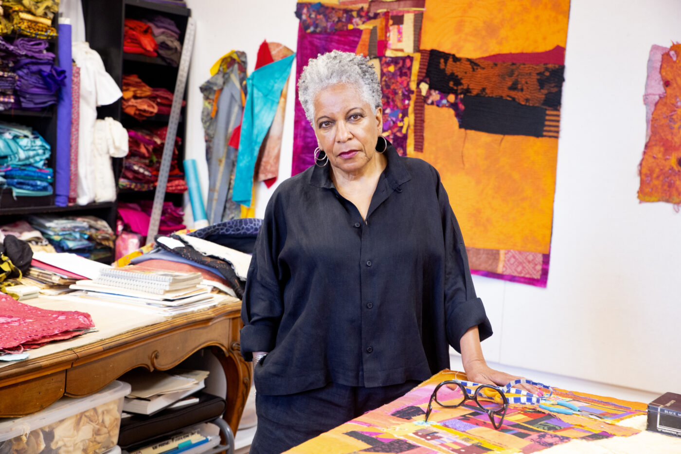 Black woman senior manager 39 reviewing career notebook diagnostic kitchen table evening