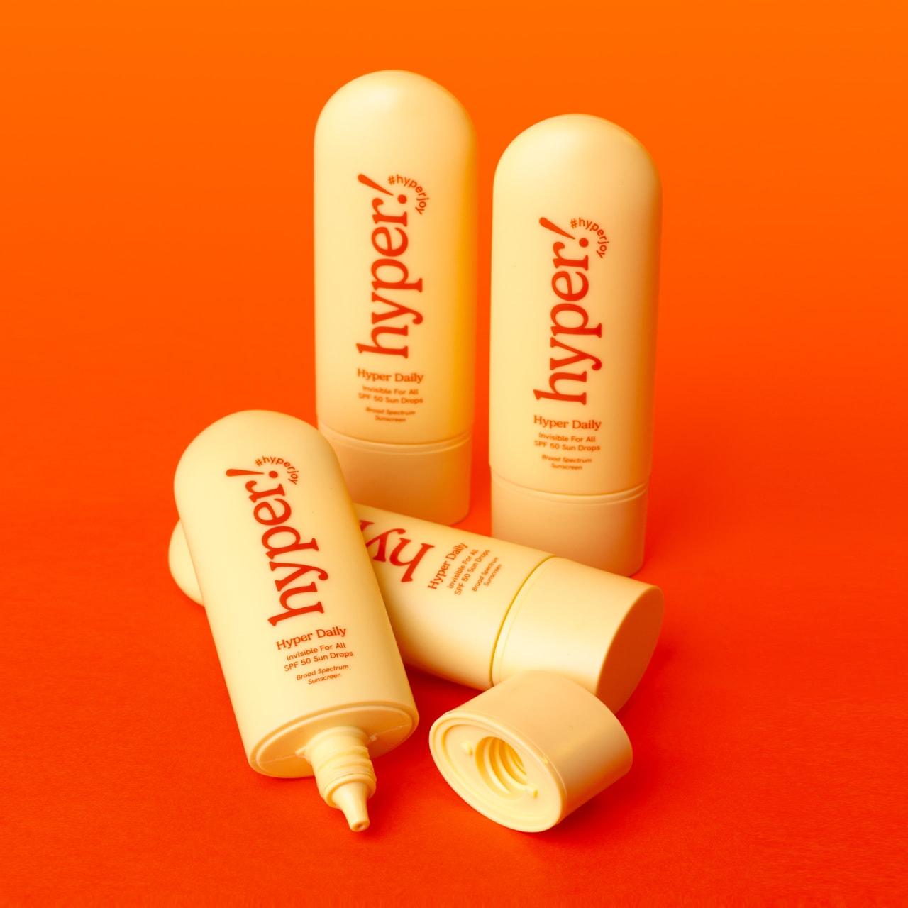 Plus-size body hyperpigmentation routine flat lay with Hyper Skin serum, lotion, and sunscreen