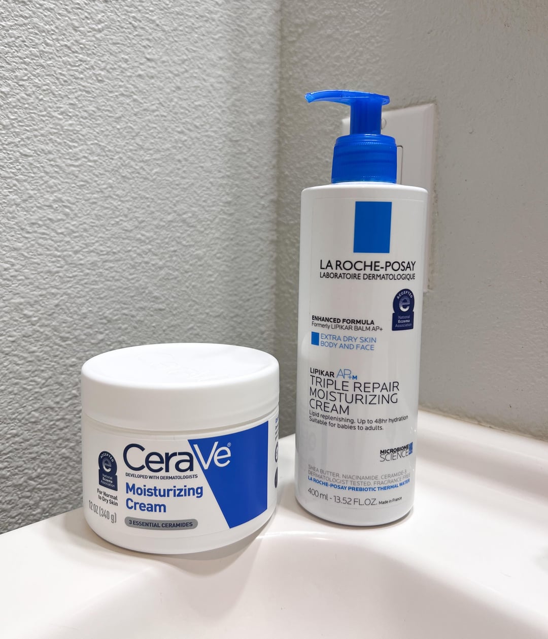 La Roche-Posay Lipikar Baume next to CeraVe and Cetaphil moisturizing creams for comparison
