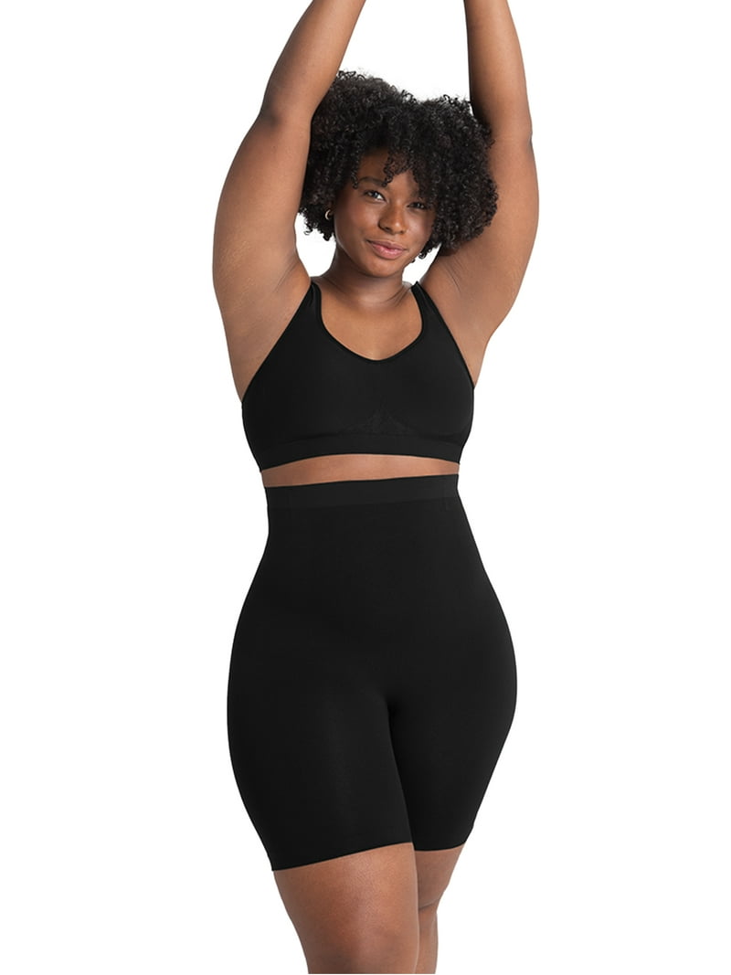 A plus-size woman in high-waisted tummy-control shaping shorts looking comfortable