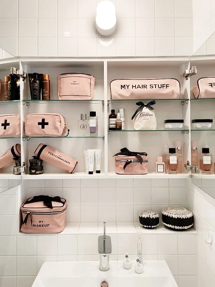 A soft cotton bra and a tube of barrier cream arranged on a bathroom shelf
