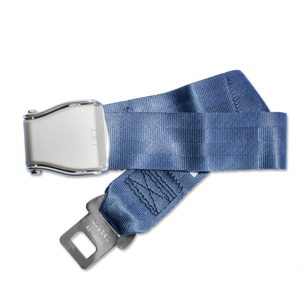 Airplane seatbelt extender held next to a standard seatbelt buckle
