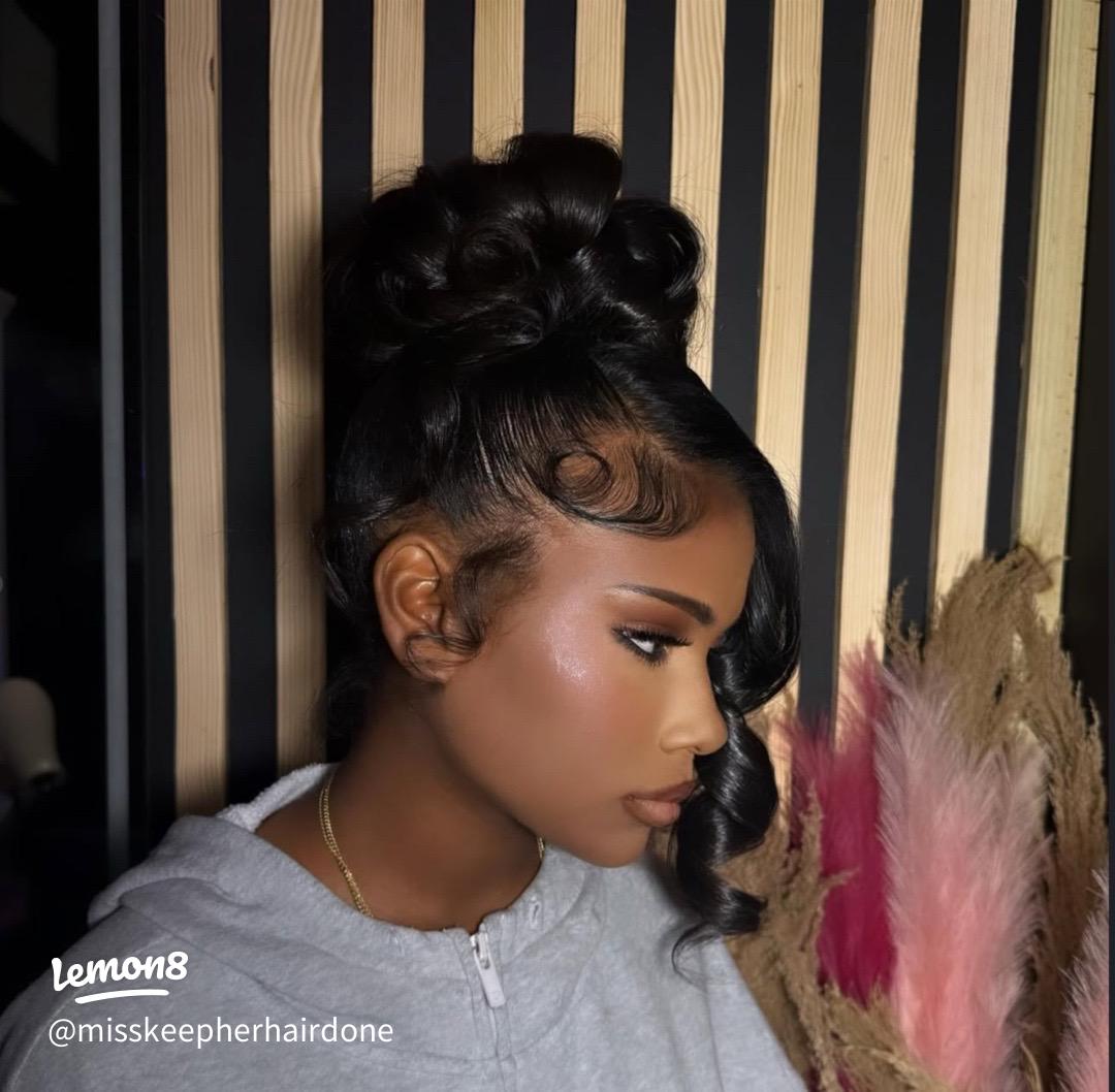 Close-up of beautifully laid edges on Black woman with elegant updo