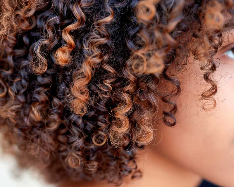 Close-up of defined moisturized 4B natural hair with visible sheen