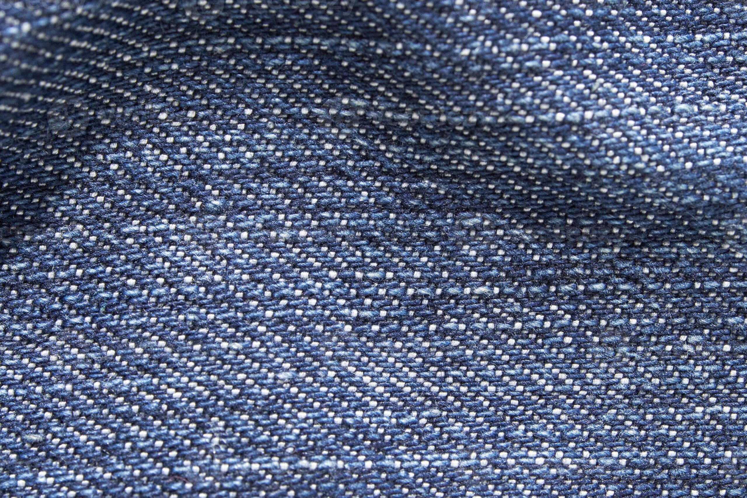 Close-up of stretch denim fabric showing the weave and give