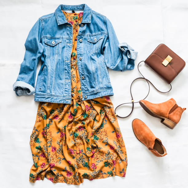 Colorful flat lay of spring clothing items including dresses, knits, and accessories