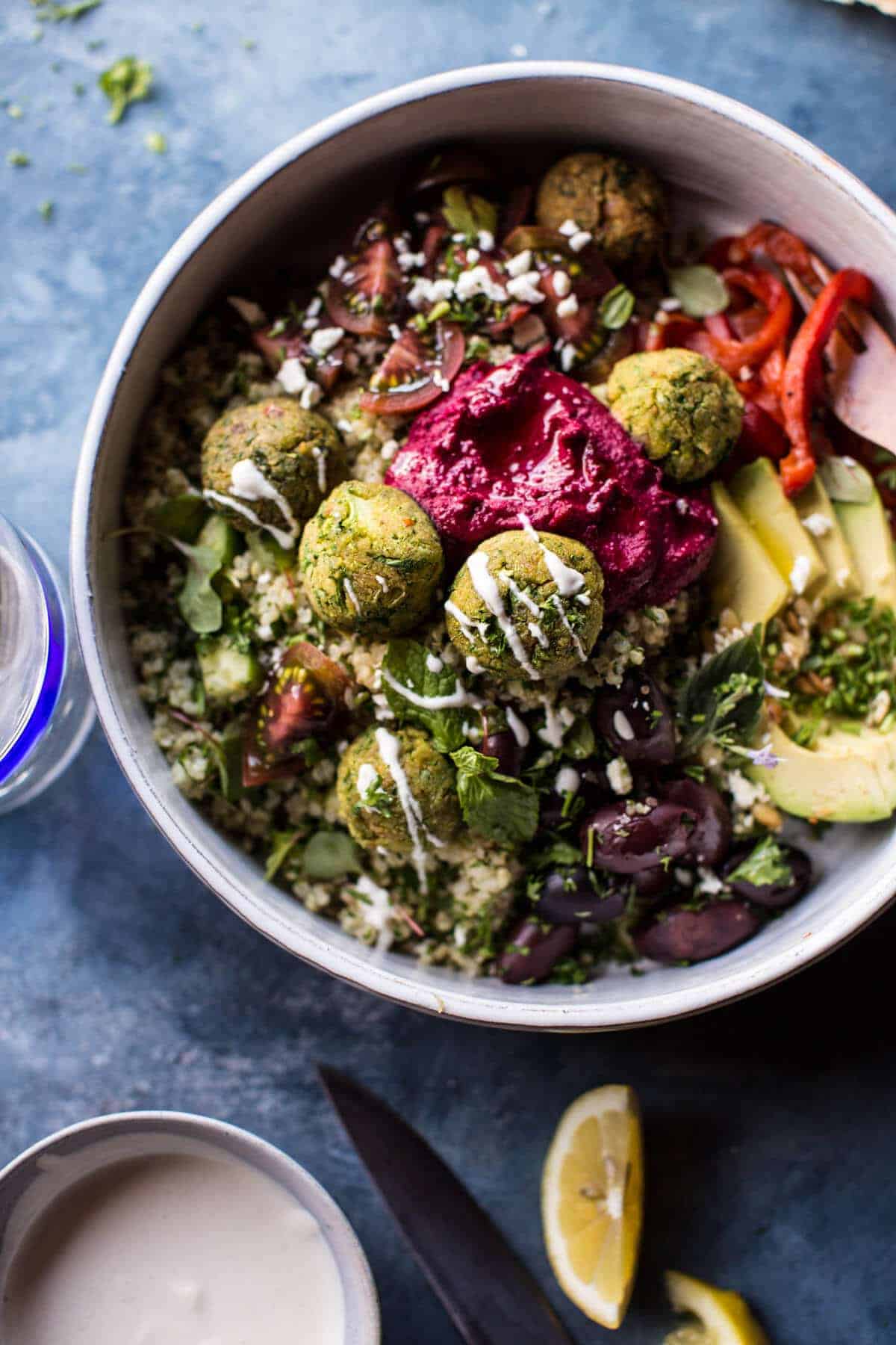 Colorful Mediterranean baked falafel bowl with fresh toppings