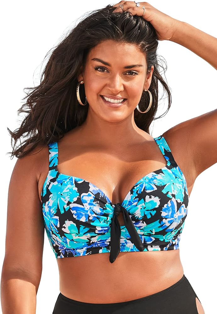 A plus-size woman in a supportive underwire swimsuit with wide straps