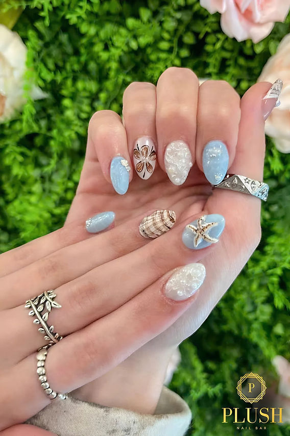 Five different almond nail designs showing the versatility of the shape