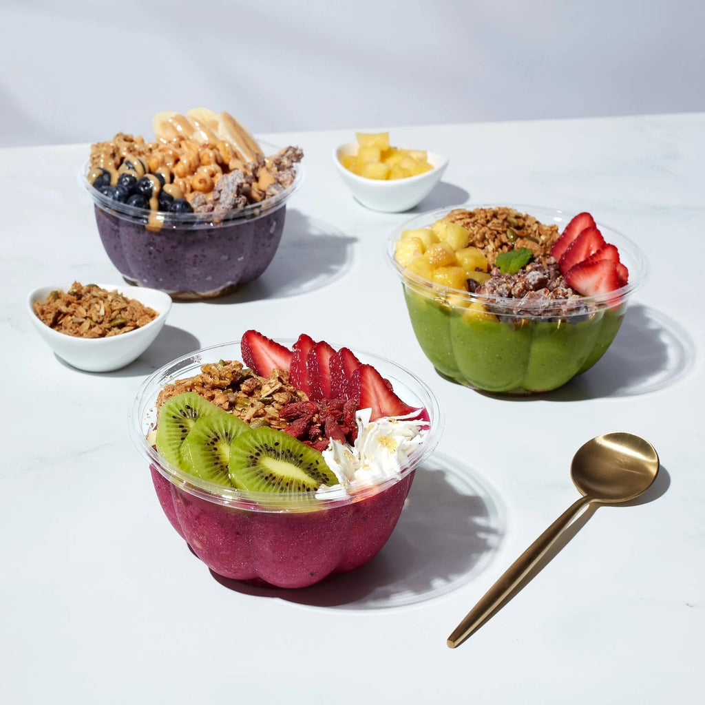 Healthy post-walk recovery foods arranged on table with smoothie bowl and fresh fruits