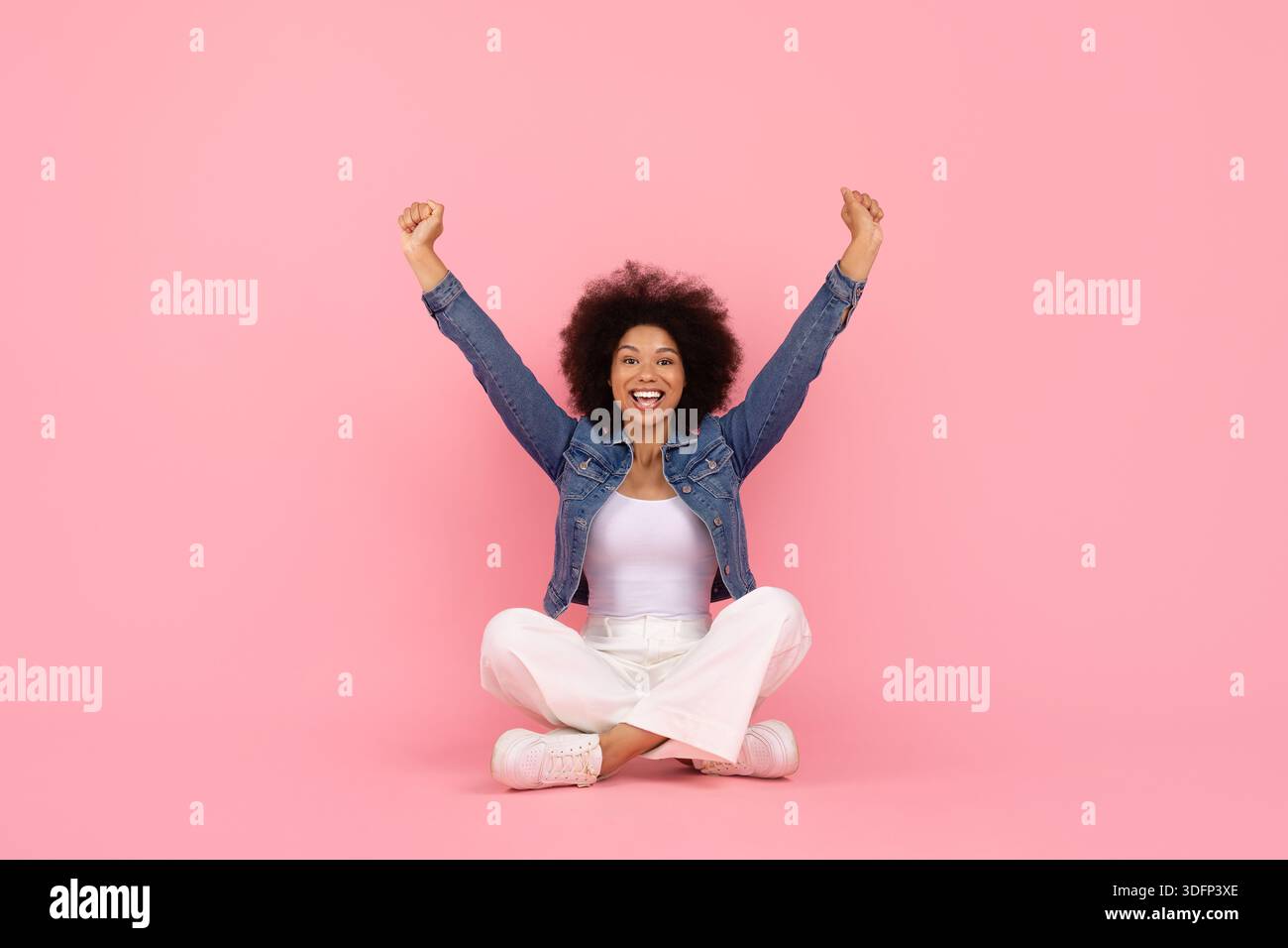 Joyful plus-size woman celebrating on walking path with arms raised triumphantly