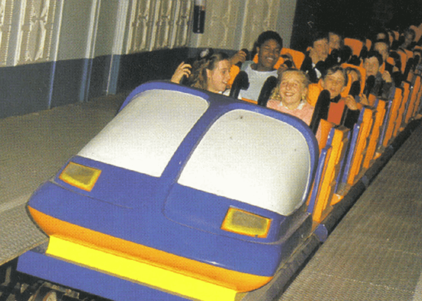 Close view of an over the shoulder roller coaster harness in an empty train