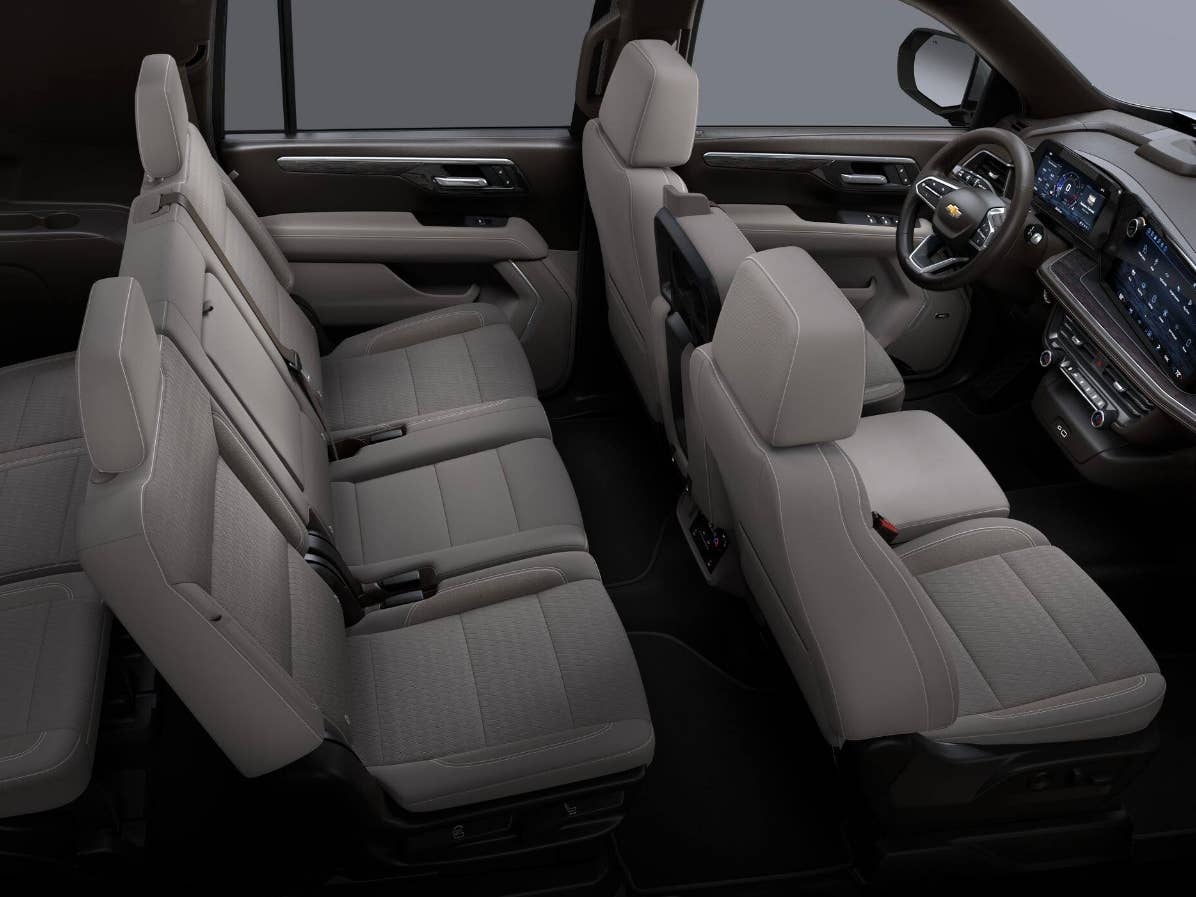 Interior of an SUV showing wide front seats and a centre console between them