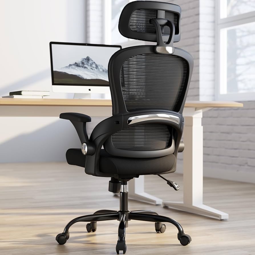 Wide ergonomic office chair with mesh back beside a desk in a home workspace